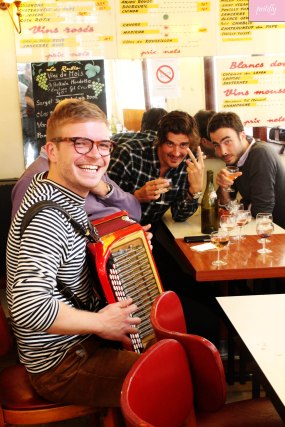 Accordian Player at one of Paris's bustling cafes
